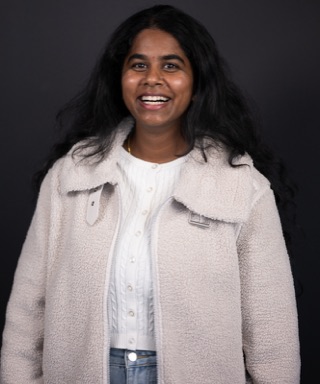 Alpha Team member smiling in studio portrait at our Los Angeles sessions